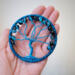 Blue Tree of Life suncatcher with crackle glass beads, wire branches, and a yarn-wrapped hoop. Handmade by Beneath the Oak Designs.